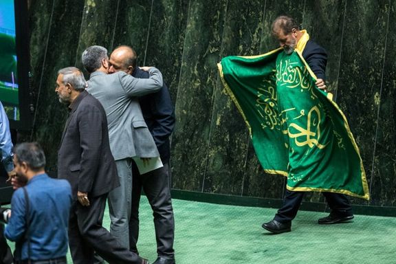 Iranian lawmakers greet each other at the beginning of a session, Tehran, Iran, September 27, 2025