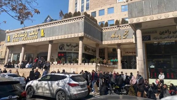 People lining up outside a bank in Tehran to buy US dollars. February 20, 2023