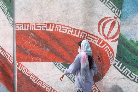 An Iranian woman walks in a street in Tehran, Iran, April 9, 2023.