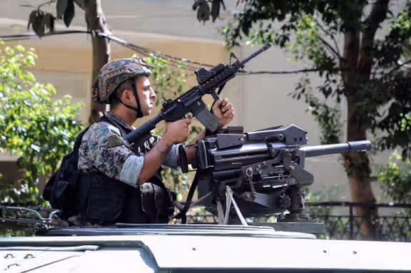 Lebanese Army soldiers keep watch as sectarian clashed take place in Beirut. October 14, 2021