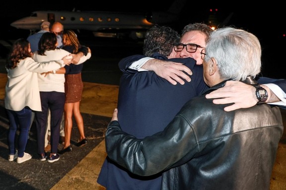 Family members embrace freed Americans Siamak Namazi, Morad Tahbaz and Emad Shargi — as well as two returnees whose names have not yet been released arrive at Davison Army Airfield at Fort Belvoir, Virginia, September 19, 2023.