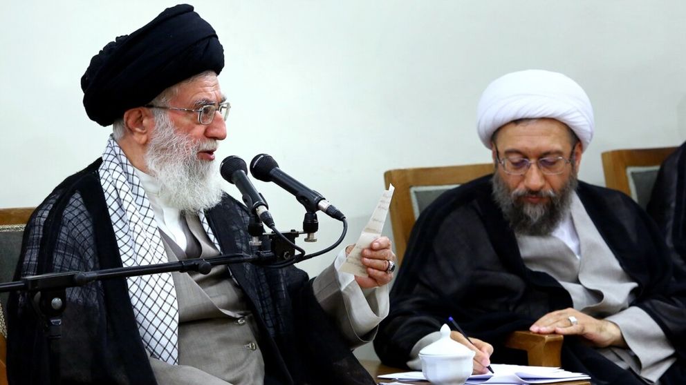 Supreme Leader Ali Khamenei (left) and Expediency Council chief Sadeq Amoli-Larijani 