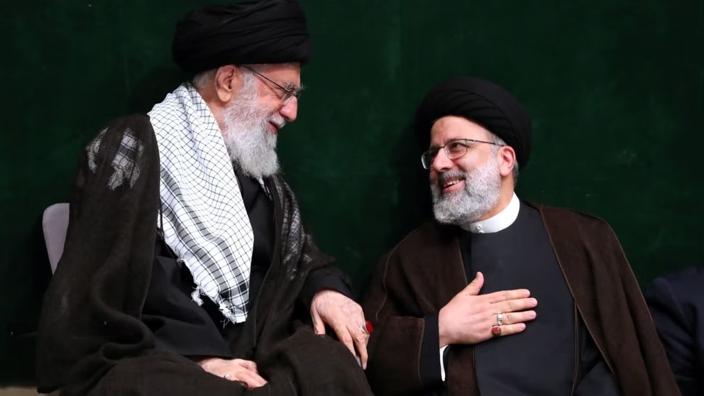 Iran’s Supreme Leader Ali Khamenei (right) and President Ebrahim Raisi  