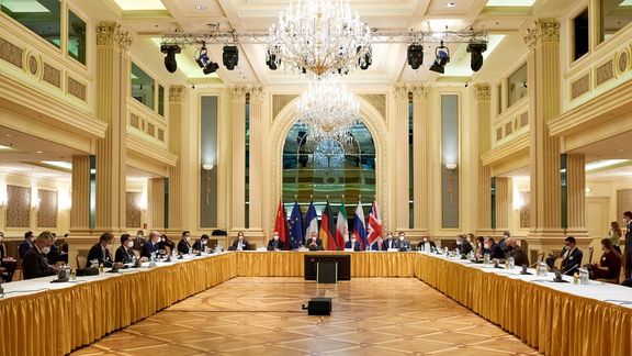 European External Action Service (EEAS) Deputy Secretary General Enrique Mora and Iranian Deputy at Ministry of Foreign Affairs Abbas Araghchi wait for the start of a meeting of the JCPOA Joint Commission in Vienna, Austria April 6, 2021.