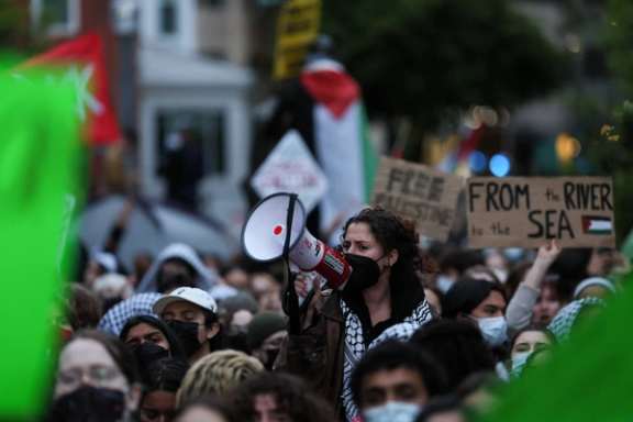 A protester uses a bullhorn as students and others demonstrate at a protest encampment at University Yard in support of Palestinians in Gaza, during the ongoing conflict between Israel and the Palestinian Islamist group Hamas, at George Washington University in Washington, April 25.