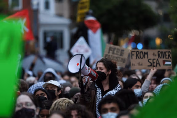 A protester uses a bullhorn as students and others demonstrate at a protest encampment at University Yard in support of Palestinians in Gaza, during the ongoing conflict between Israel and the Palestinian Islamist group Hamas, at George Washington University in Washington, April 25.