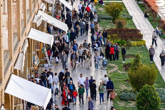 People walking in Iran's historic Naqsh-e Jahan square, Isfahan, Iran, March 25, 2025