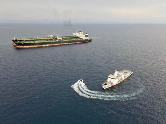 Patrol vessel KN. Pulau Marore-322, owned by Indonesia's Maritime Security Agency (Bakamla) patrols to inspect the Iranian-flagged Very Large Crude Carrier (VLCC), MT Arman 114, and the Cameroon-flagged MT S Tinos, as they were spotted conducting a ship-to-ship oil transfer without a permit, according to Indonesia's Maritime Security Agency (Bakamla), near Indonesia's North Natuna Sea, Indonesia, July 7, 2023 in this handout picture released July 11, 2023.