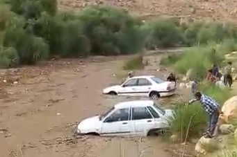 Cars stuck in floodwater in Iran’s southwestern province of Fars