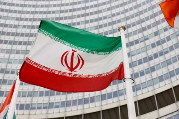 Iran's flag flies outside the Vienna headquarters of the IAEA. FILE PHOTO