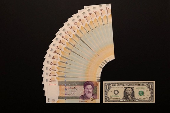 One US dollar equals more than twenty 50,000-rial banknotes.