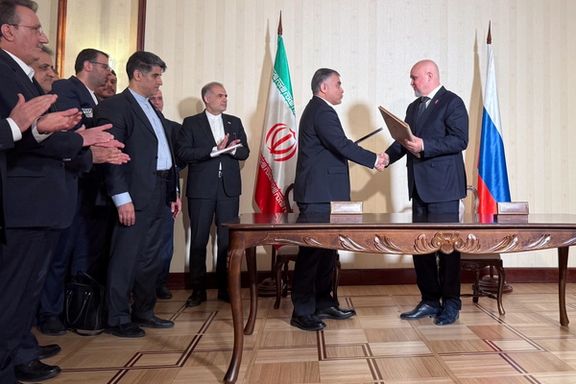 Russian Energy Minister Sergei Tsivilev and Iranian Oil Minister Mohsen Paknejad exchange documents during a signing ceremony in Moscow, Russia, April 25, 2025.