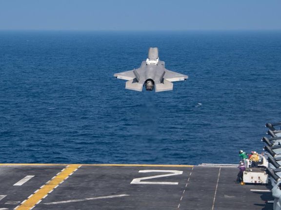 A US Navy warplane taking off from an aircraft carrier in November 2021.