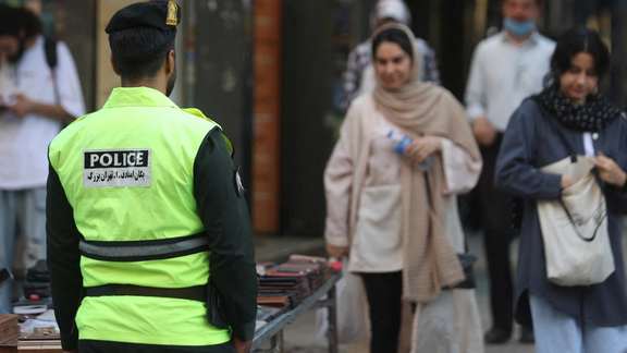 Iranian women walk on a street during the revival of morality police in Tehran, Iran, July 16, 2023.