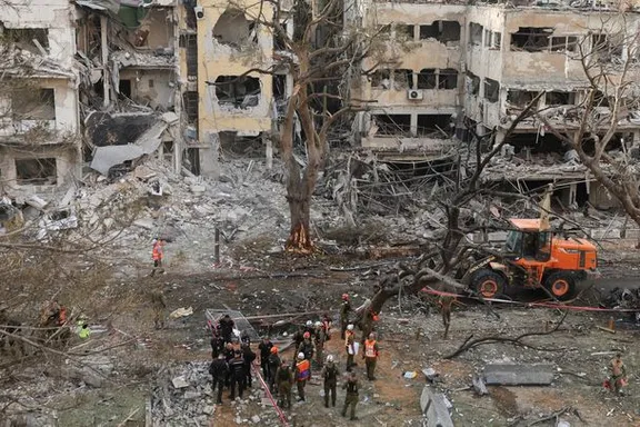 Emergency personnel work at an impact site after missiles were launched from Iran to Israel, in Tel Aviv, Israel, June 16, 2025.