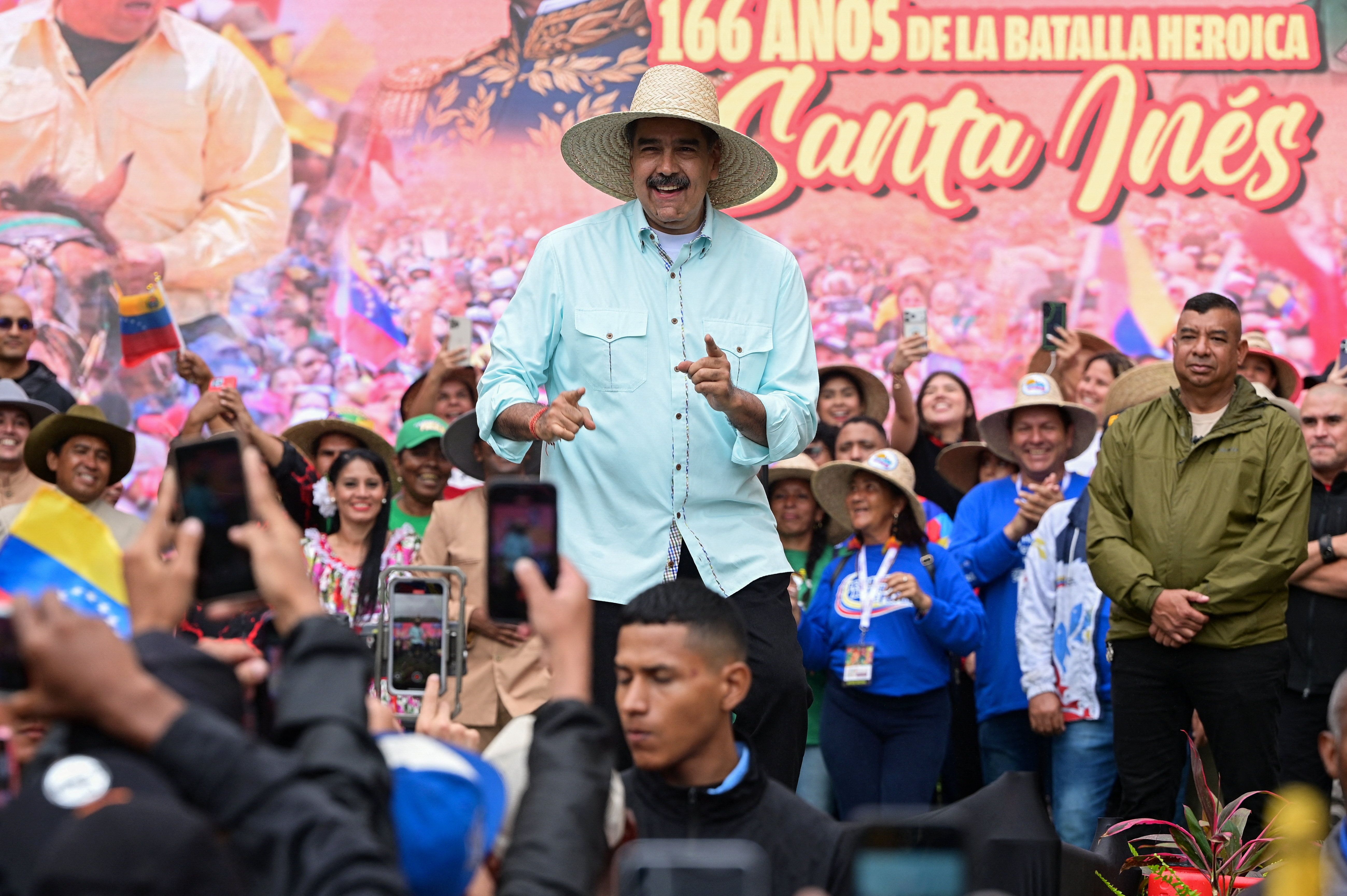 Venezuela's President Nicolas Maduro points towards supporters, during a march to commemorate the Battle of Santa Ines, on the same day Venezuelan opposition leader Maria Corina Machado was awarded the 2025 Nobel Peace Prize in Norway, in Caracas, Venezuela, December 10, 2025. 
