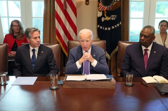US President Joe Biden, flanked by Secretary of State Antony Blinken and Secretary of Defense Lloyd Austin, makes a statement to the news media ahead of a cabinet meeting at the White House in Washington, October 2, 2023.