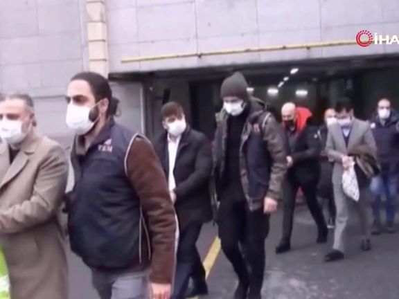 Suspects being led away by Turkish security agents.