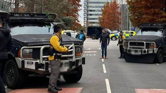 Police vehicles protecting Iran International's headquarters in London in Nov. 2022