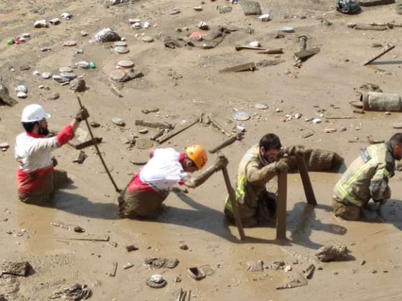 Rescue teams looking for bodies of the victims of mudslide north of Tehran on July 28, 2022