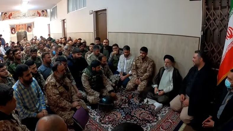 Iran’s then-President Ebrahim Raisi meets members of the Fatehin unit after the crackdown on the 2022 protests. 