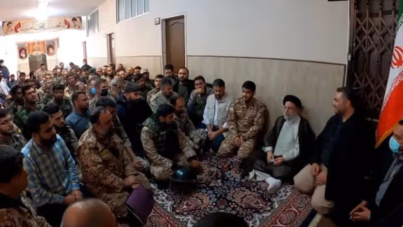 Iran’s then-President Ebrahim Raisi meets members of the Fatehin unit after the crackdown on the 2022 protests.