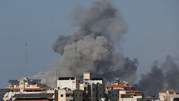 Smoke rises following Israeli strikes in Gaza, October 12, 2023.