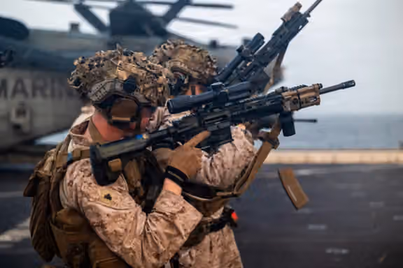 US Marines train on the flight deck of the USS Portland as the amphibious transport dock sails in the Arabian Sea. US Central Command/X