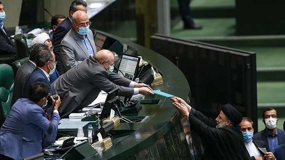 President Ebrahim Raisi handing over the draft budget to Parliament Speaker Ghalivaf on Sunday.