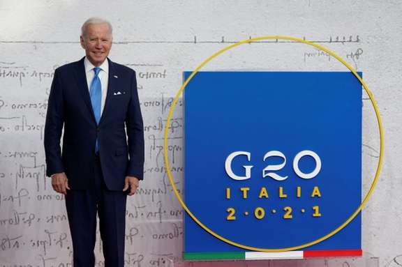 US President Joe Biden poses for a picture as he arrives for the G20 leaders' summit in Rome, Italy October 30, 2021.