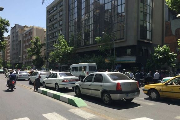 People gathered in front of the building of Foundation of Martyrs and Veterans Affairs after the shooting in Tehran on May 28, 2022.