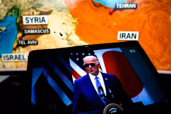 President Joe Biden, appears talking about the war between Iran and Israel, in a video on a smartphone screen.