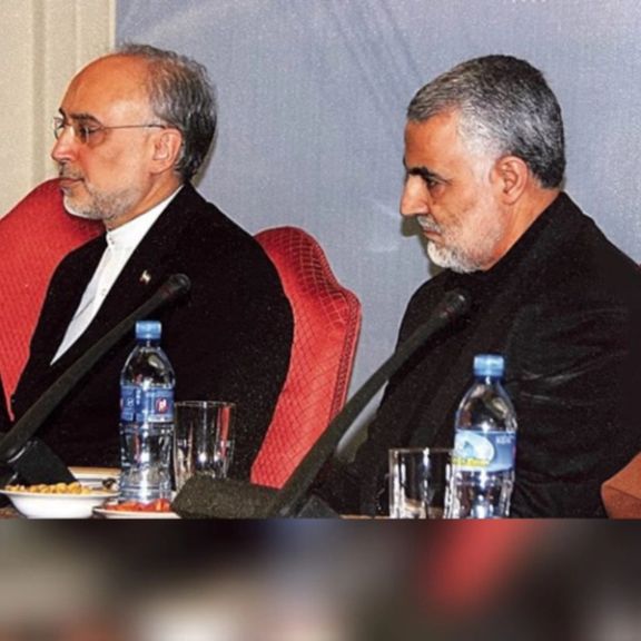 An undated old photo showing Soleimani (R) and Salehi.