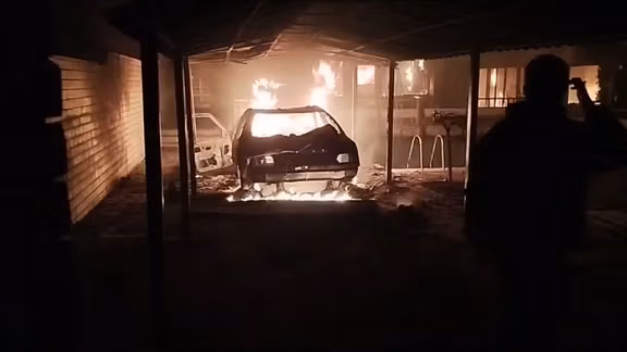 A car burning during antigovernment protests in Mashhad in January 2026