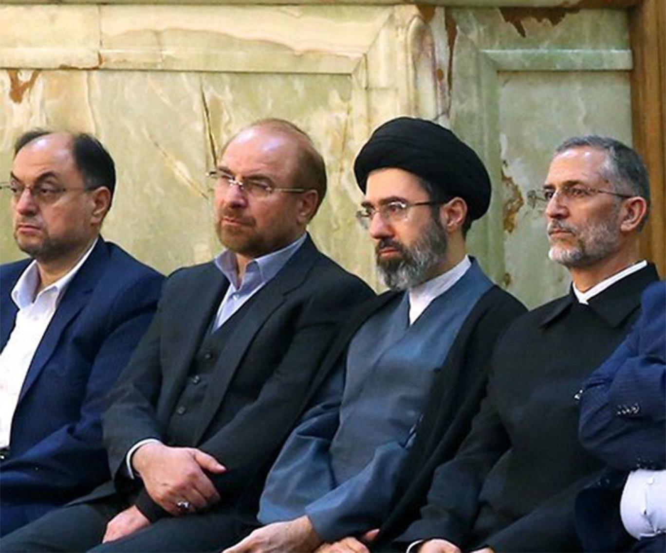 An archival photograph shows Iranian Parliament Speaker Mohammad Bagher Ghalibaf (second from left) and Supreme Leader Mojtaba Khamenei (second from right) attending a gathering in Tehran.