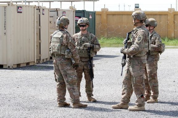 US soldiers are seen before a handover ceremony of K-1 airbase from US-led coalition forces to Iraqi security forces, in Kirkuk governorate, Iraq, March 29, 2020.