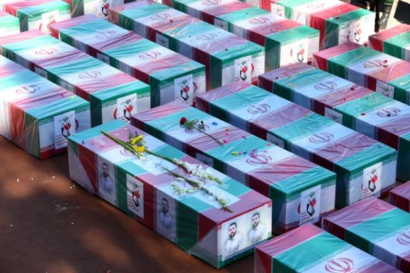 Coffins of casualties of the Islamic State attack in Kerman, lie during a funeral ceremony in Kerman, Iran, January 5, 2024.