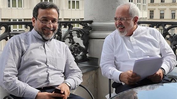 Former Deputy Foreign Minister Abbas Araghchi (L) and former Foreign Minister Mohammad Javad Zarif