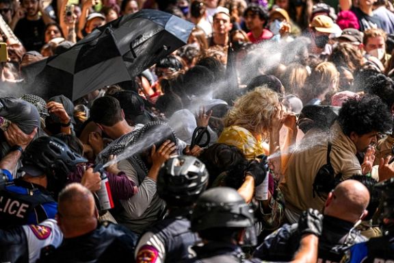 A state trooper pepper sprays pro-Palestinian protesters, during the ongoing conflict between Israel and the Palestinian Islamist group Hamas, after police vehicles were blocked at the University of Texas in Austin, Texas, US April 29, 2024.