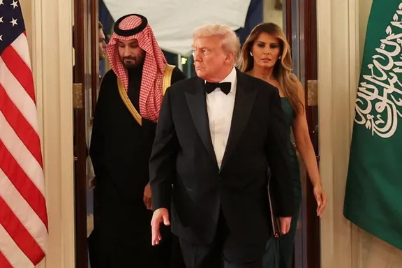 US President Donald Trump, first lady Melania Trump and Saudi Crown Prince and Prime Minister Mohammed bin Salman arrive for a dinner, in Washington, DC, November 18, 2025.