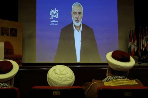 Hamas chief Ismail Haniyeh speaks in a pre-recorded message shown on a screen during an event ahead of al-Quds (Jerusalem) Day on Friday April 5, Lebanon, April 3, 2024.