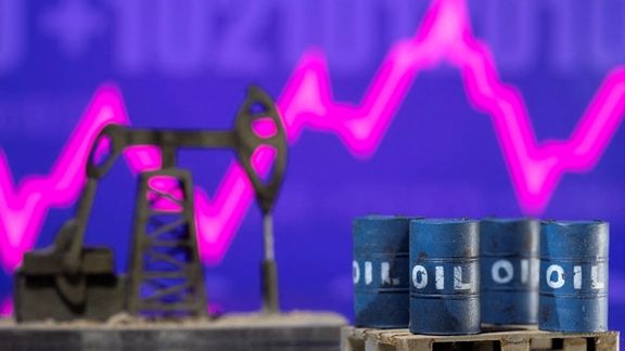 Models of oil barrels and a pump jack are displayed in front of a rising stock graph in this illustration taken February 24, 2022.