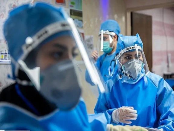 Nurses in Iran, fully equipped with protective gear as they carry out their duties in a medical setting
