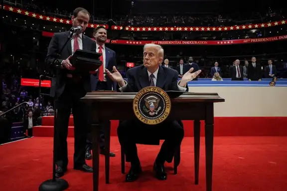 The US President Donald Trump gestures on the day he signs the freedom of speech executive order during the inaugural parade inside Capital One Arena on the inauguration day of his second presidential term, in Washington, US January 20, 2025.