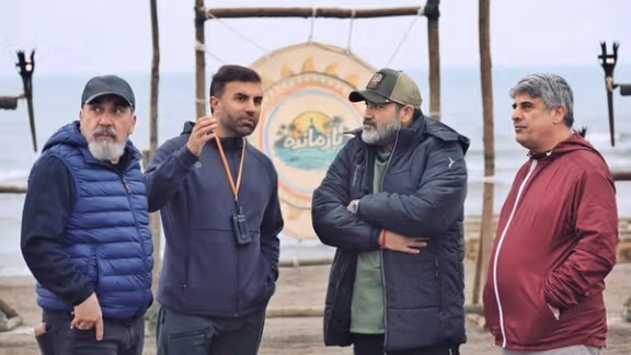 Siamak Ansari (left) and Mehran Ghafourian (2nd left) behind the scenes of the show (undated)