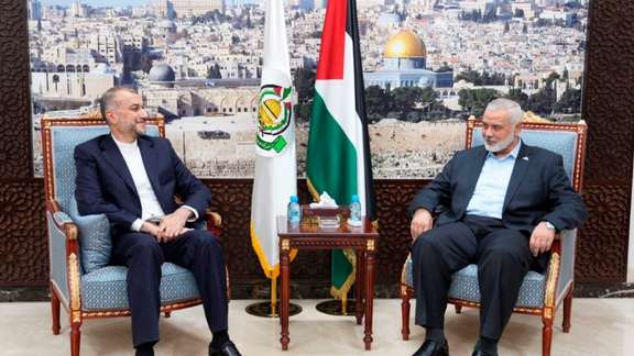 Iranian Foreign Minister Hossein Amir-Abdollahian (left) and Hamas leader Ismail Haniyeh in Qatar on October 14, 2023