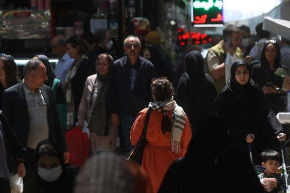 An Iranian woman walking unveiled in Tehran