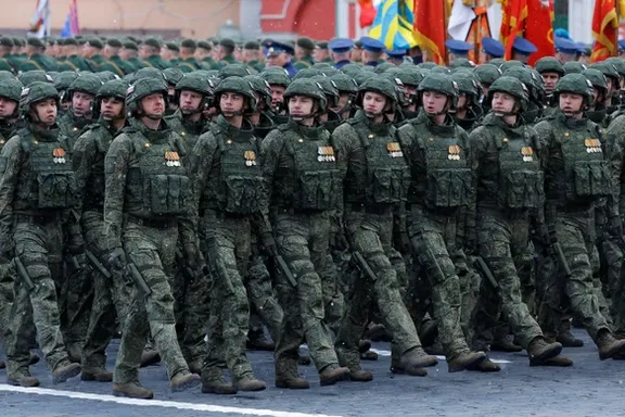 Russian service members, who were involved in the country's military campaign in Ukraine, march in columns during a military parade on Victory Day in Red Square in Moscow, Russia, May 9, 2024.