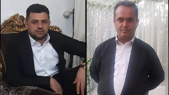 Kurdish porters Azad Shojaei (right) Edris Aali (left)