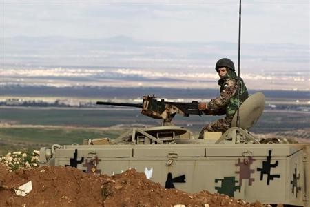 A Jordanian soldier guarding the border with Syria